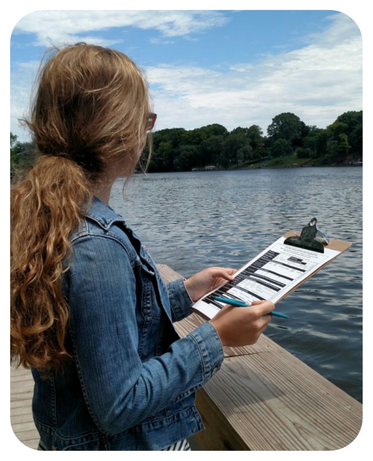 Woman monitoring a lake