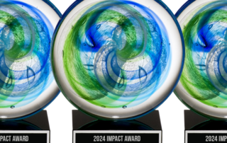 2024 Impact Award - A glass Circle with Green and Blue swirling inside