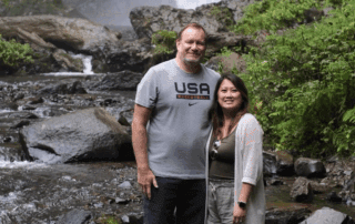 Phil Wisneski and his wife, Xong, enjoying a quiet moment together by the water.