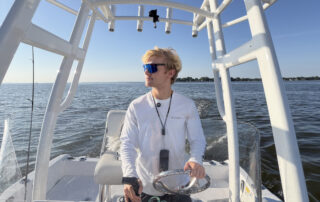 Fisherman Matthew Crawford driving his boat on Lake Winnebago after a morning of fishing